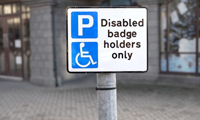 A sign showing for a parking bay that is reserved for holders of disabled badges only.