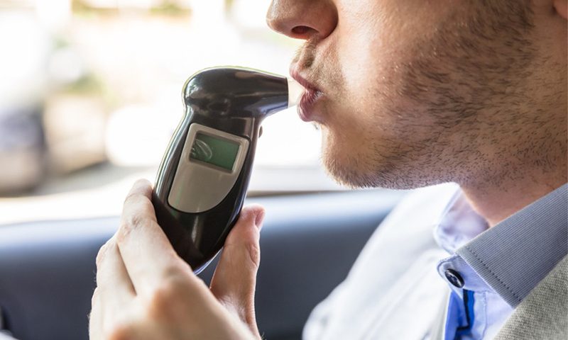 Motorist charged for drink-driving after tailgating an unmarked police car.