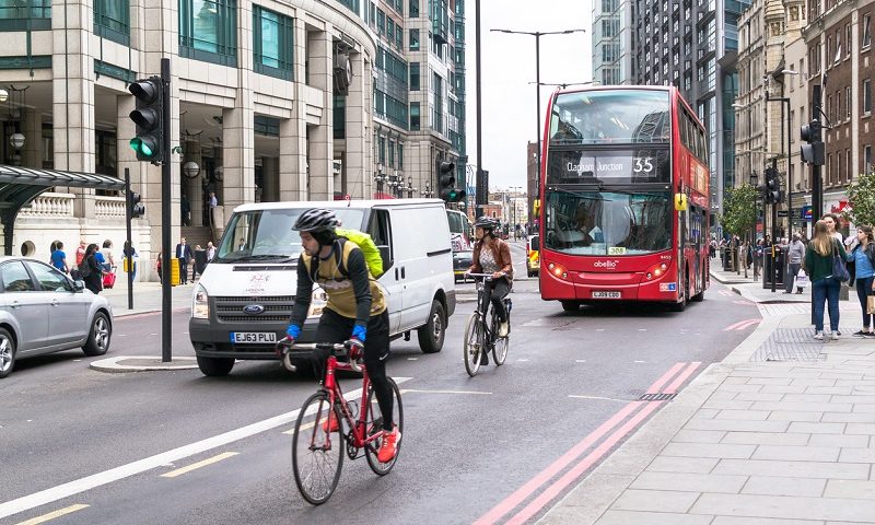 Cyclists on busy London street.