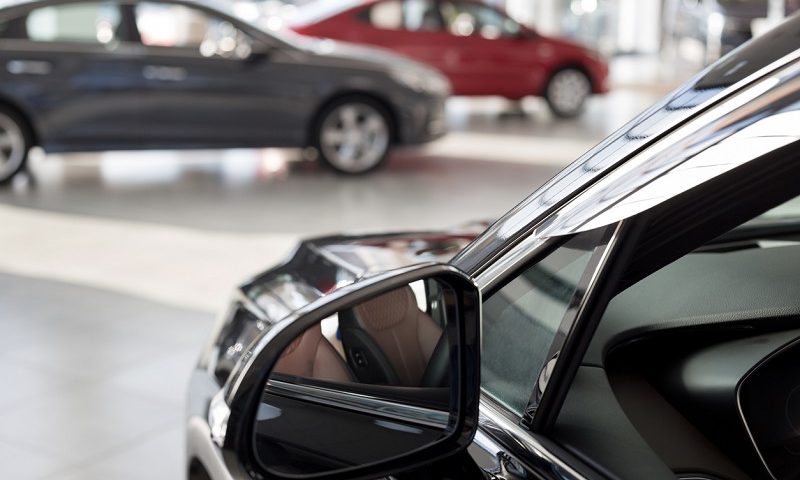 New cars in dealer showroom.