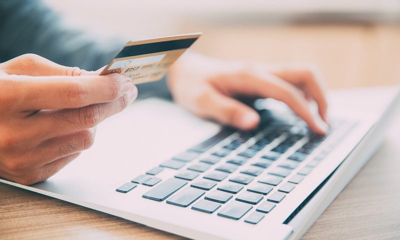 Man making purchase on laptop