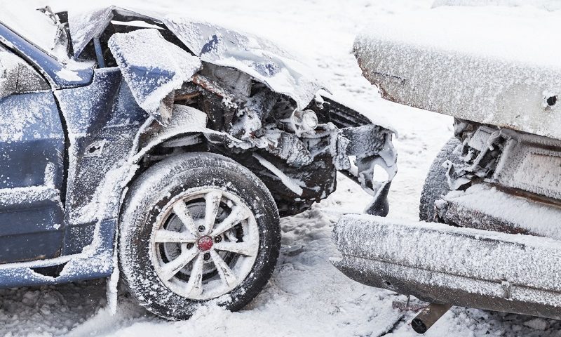 Collision of two cars in snow.