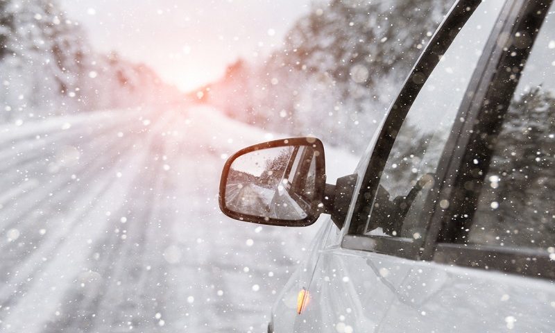 A car driving in the snow