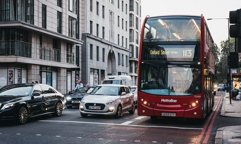 Cars and a double decker bus