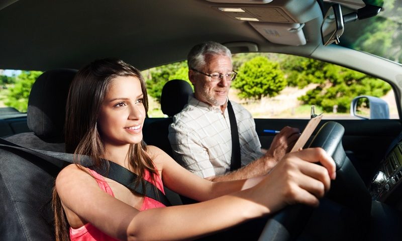 A learner driving with an instructor