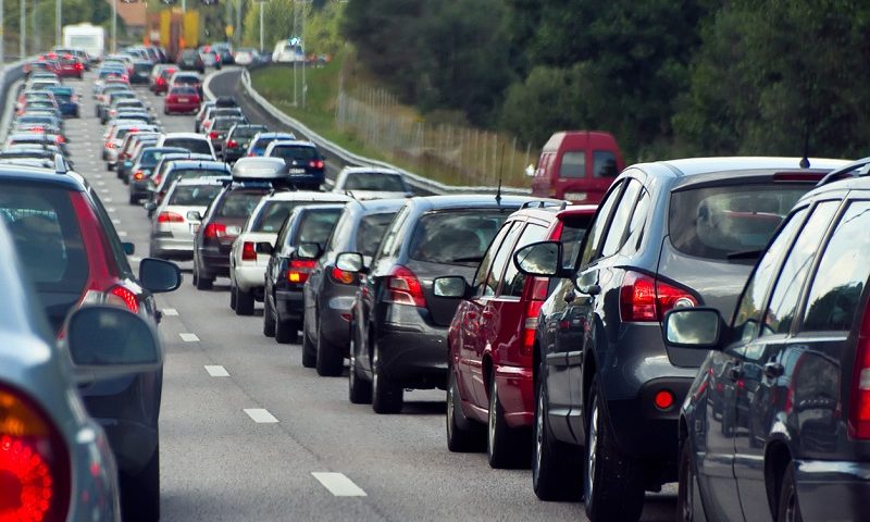 A row of cars sit in a traffic jam