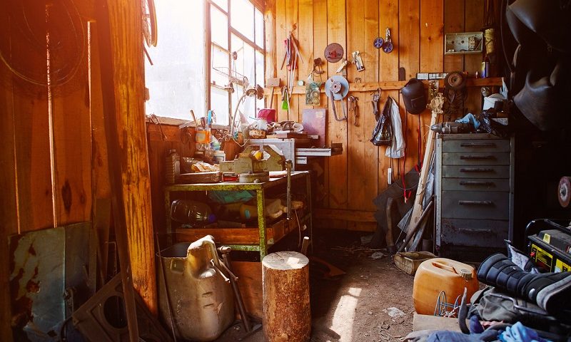 A garage being used as a workshop and storage room