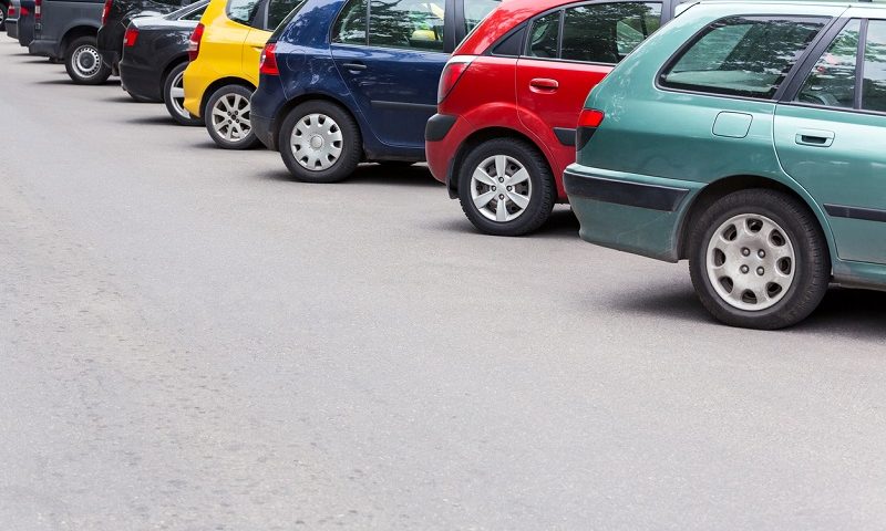 A line of cars parked outside