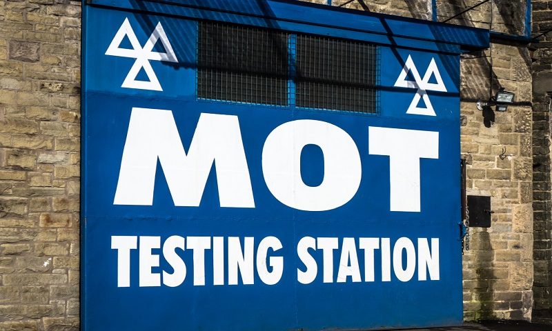 Large sign of an MOT testing station in the UK