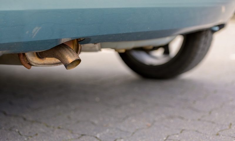 Exhaust pipe on an older car with a diesel engine