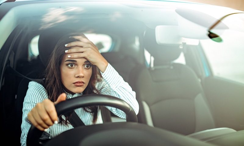 Angry woman driving a car