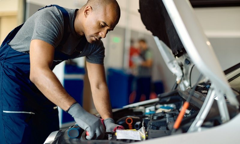 Mechanic working on a car engine