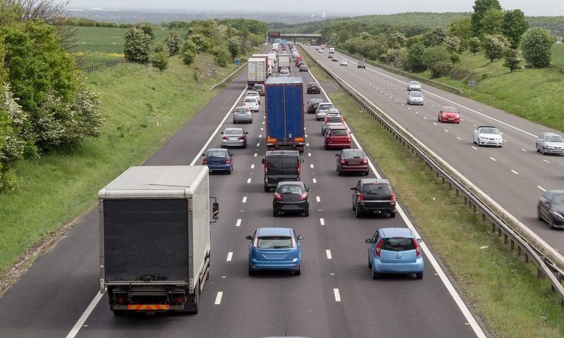 A traffic jam with rows of cars.