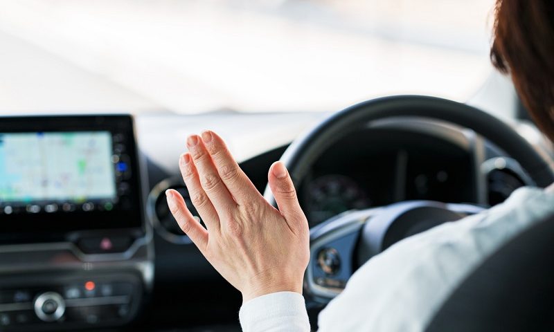 Driver at the wheel of a self-driving car.