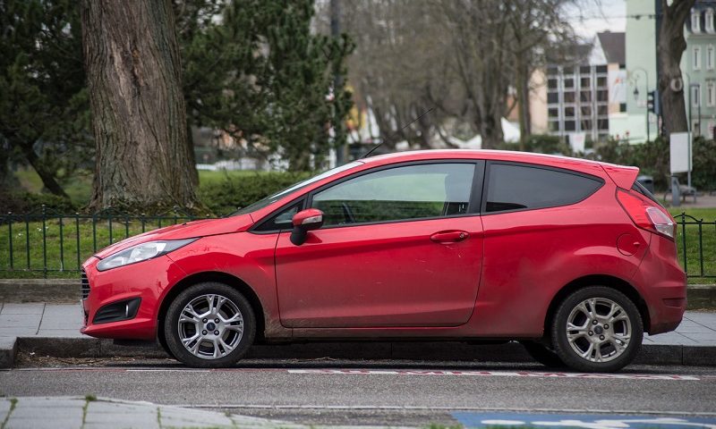 Red Ford Fiesta parked in street