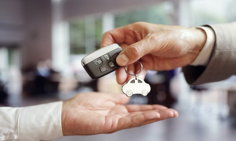 Car being sold and keys handed over