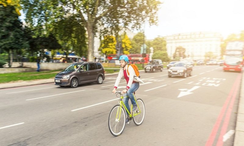 Man cycling on a road in London