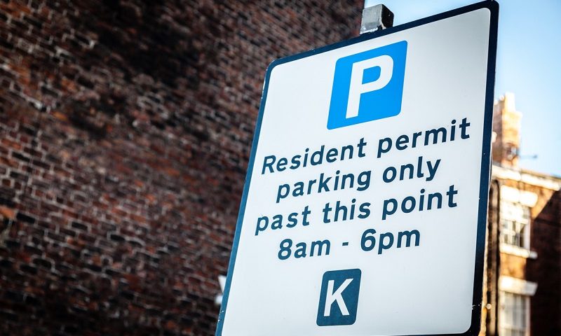 A resident permit holder only parking sign.