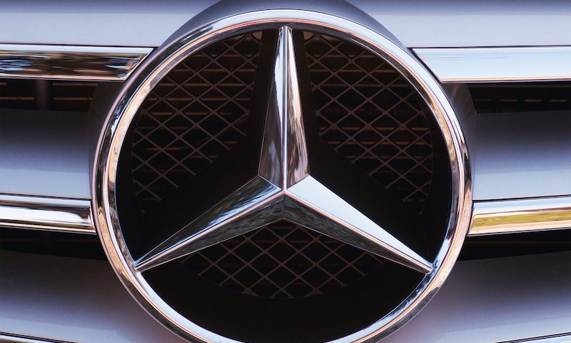 Mercedes-Benz logo on hood of car