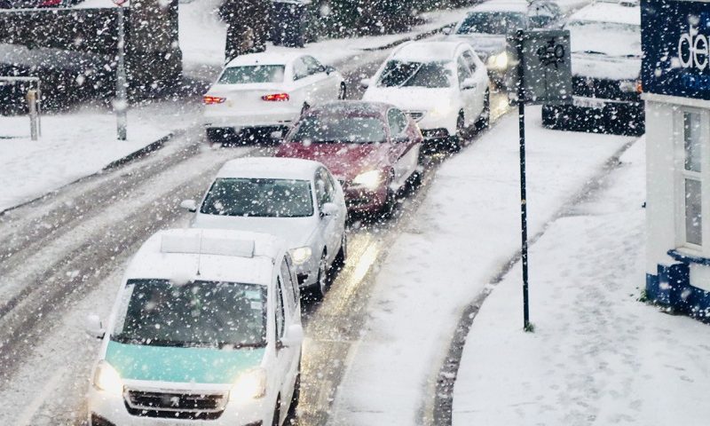 Traffic jam during heavy snowfall in Brighton.